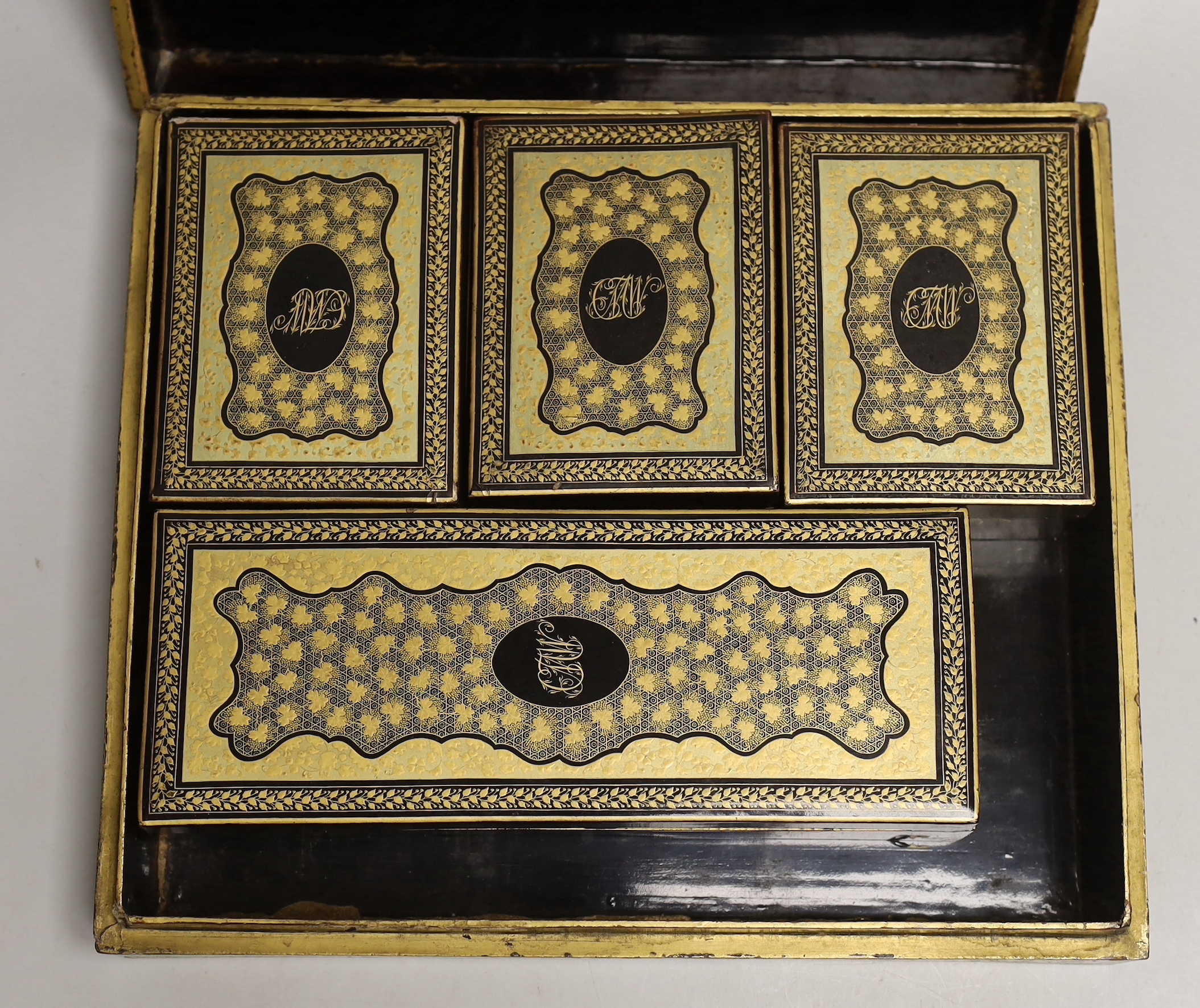 A 19th century Chinese export lacquer games box and mother of pearl counters